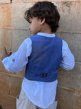 Load image into Gallery viewer, a boy showing the back of his vest with adjustable straps at lower back with antique brass buckle