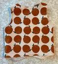 Load image into Gallery viewer, flat lay back view of vest of organic corduroy that is printed with large oranges