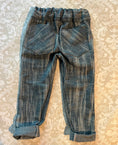 Load image into Gallery viewer, flat back view of distressed skinny jeans showing the detail of the bias cut back pockets, elastic waist and double stitching on the pockets