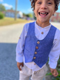 Load image into Gallery viewer, laughing boy with round neck blue chambray vest with natural wood buttons