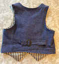 Load image into Gallery viewer, back view of blue chambray vest showing the lining and buckle