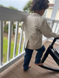 Load image into Gallery viewer, little boy showing the back of the natural linen sportscoat with back vent detail at the back