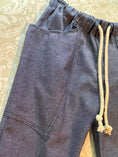 Load image into Gallery viewer, a closeup view of the side pockets to show the double stitching