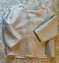 Load image into Gallery viewer, flat view of off white linen shirt showing the top stitch detail of the raglan sleeves