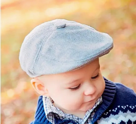 baby boy wearing  a gray herringbone tweed newsboy cap