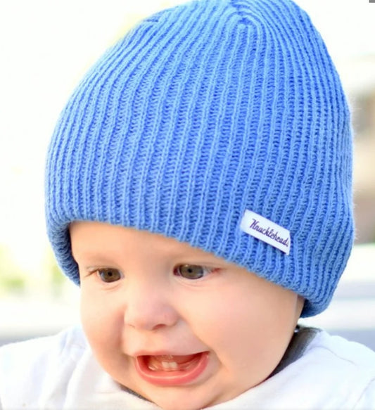 Baby wearing the light blue slouch beanie