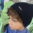 Load image into Gallery viewer, boy wearing a navy blue slouch beanie
