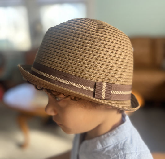 side view of dark brown straw fedora showing brown band with light brown embroidered chain detail