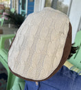 Load image into Gallery viewer, closeup view of the top of the newsboy cap showing the cream color knit 
